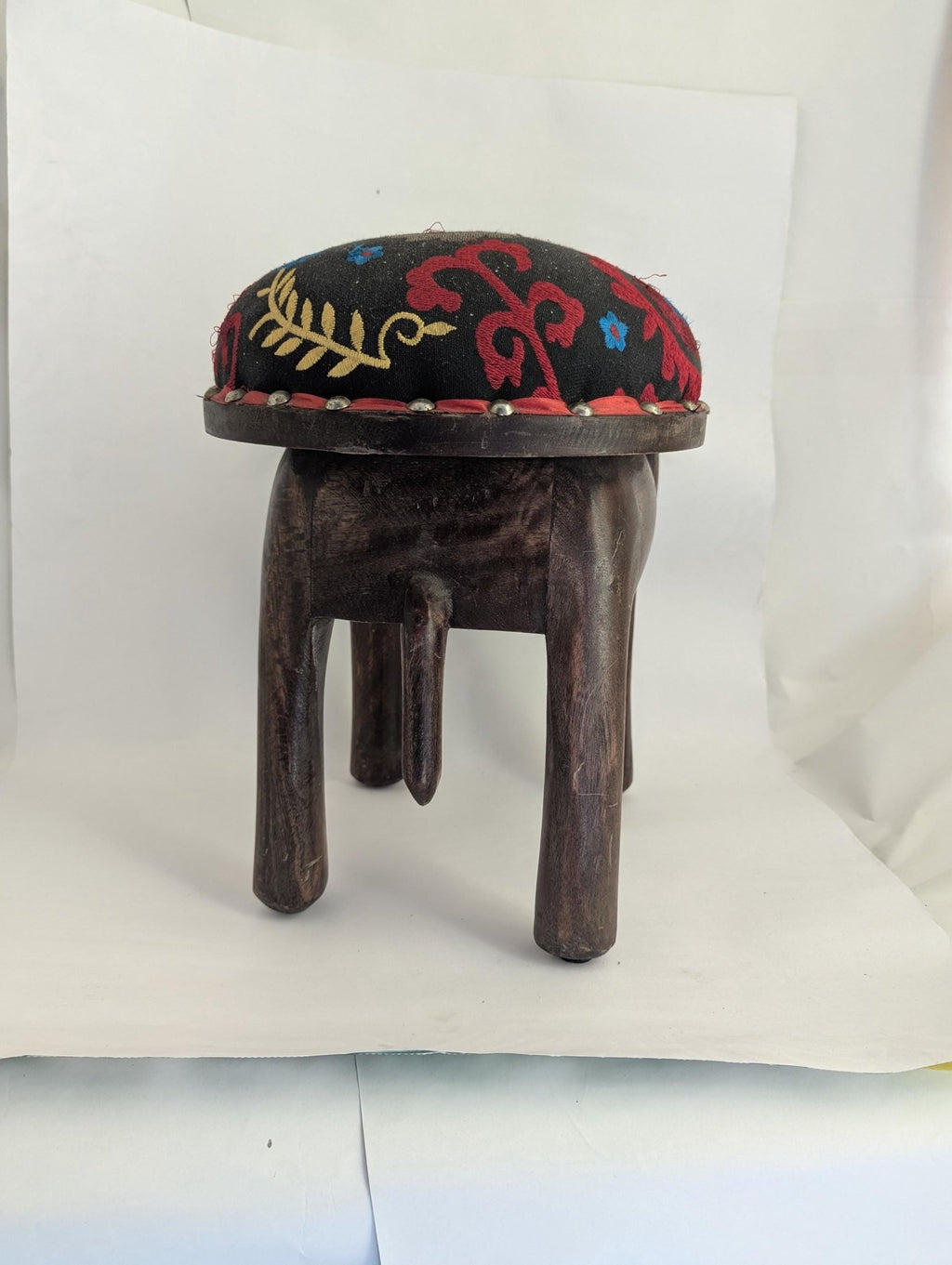 Hand-Carved Wooden Elephant Footstool: Colorful Boho Floral Upholstery - The Relic Detail