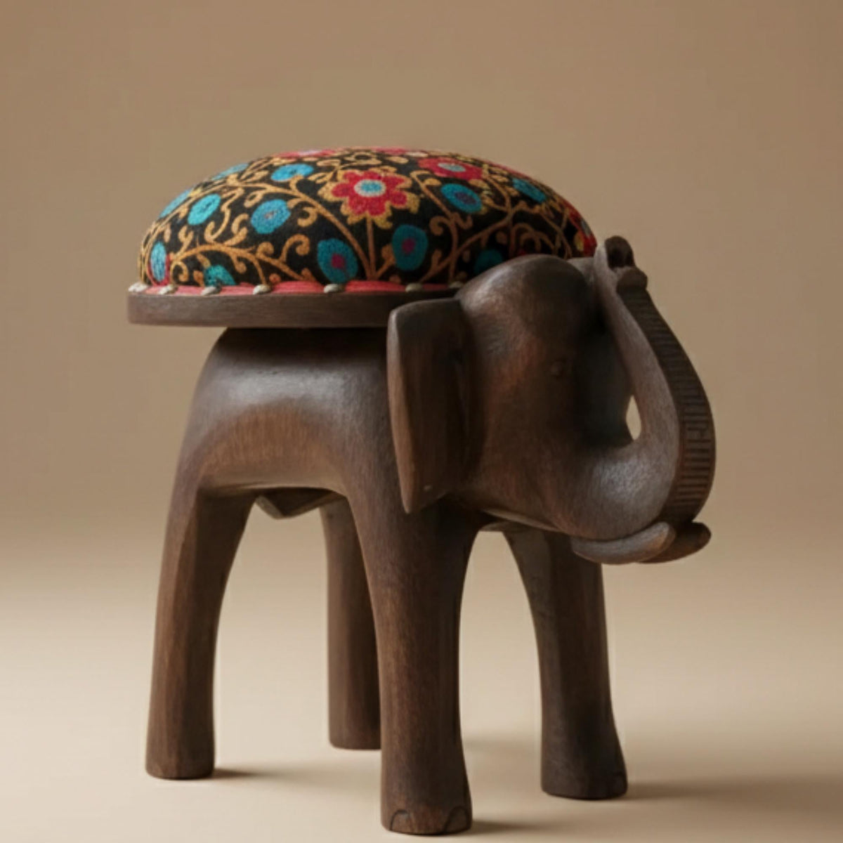 Hand-Carved Wooden Elephant Footstool: Colorful Boho Floral Upholstery - The Relic Detail