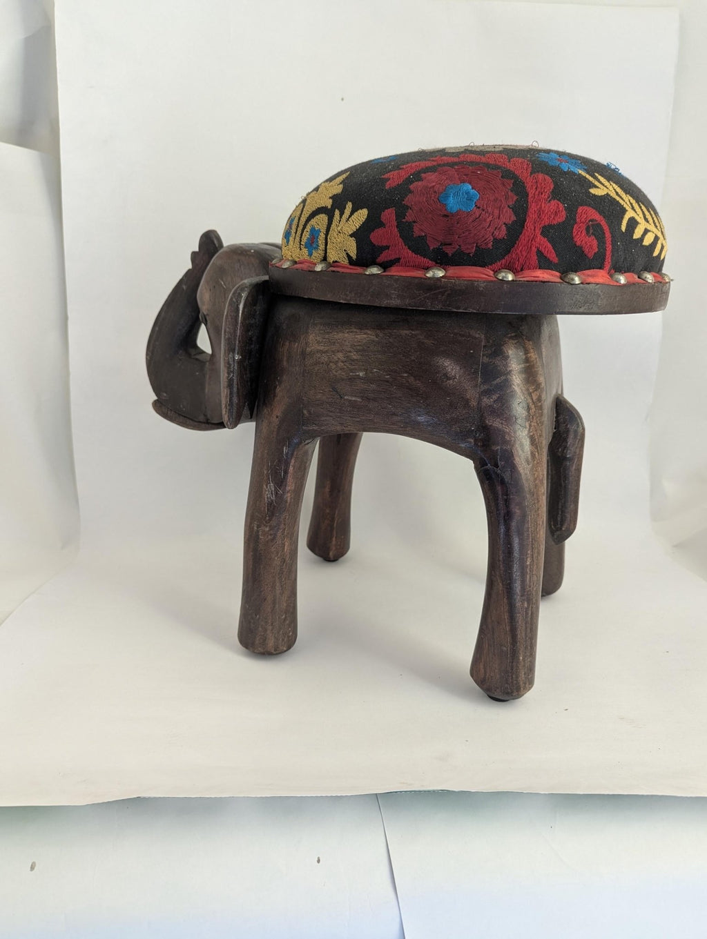 Hand-Carved Wooden Elephant Footstool: Colorful Boho Floral Upholstery - The Relic Detail
