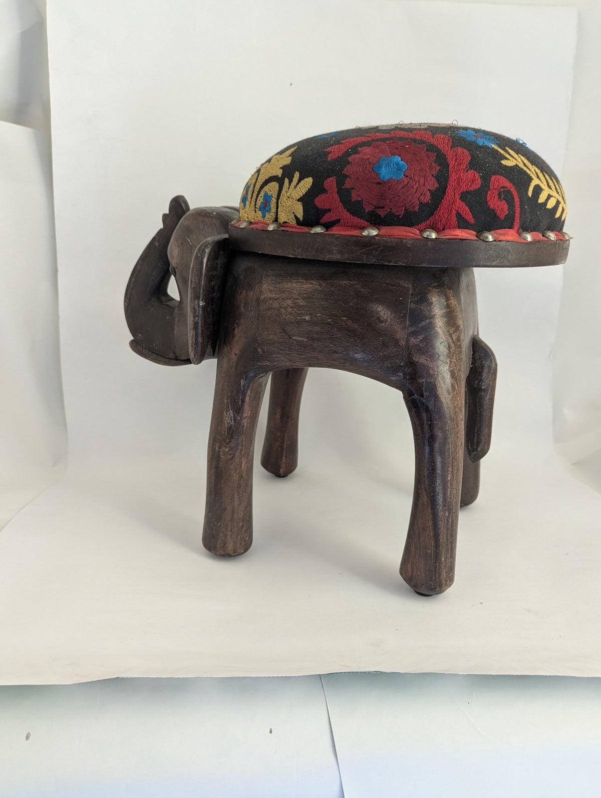 Hand-Carved Wooden Elephant Footstool: Colorful Boho Floral Upholstery - The Relic Detail